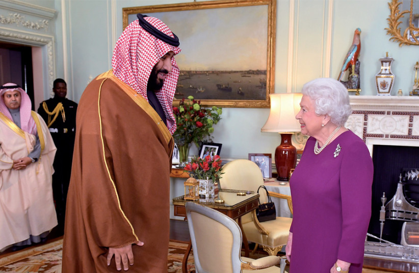 Britain’s Queen Elizabeth greets Mohammed bin Salman, the crown prince of Saudi Arabia, at Buckingham Palace in 2018 (photo credit: DOMINIC LIPINSKI / POOL / REUTERS)