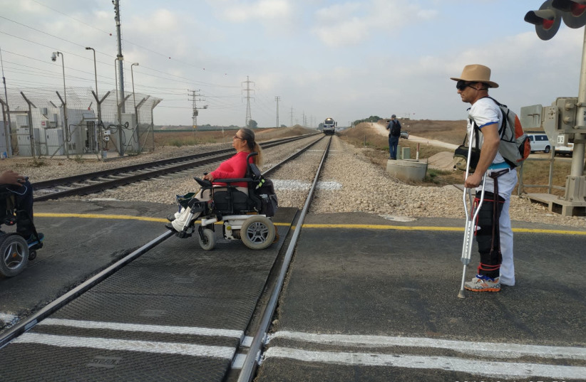 Disabled Israelis protest by blocking train tracks near Shfayim. (photo credit: DISABLED BECOME PANTHERS)