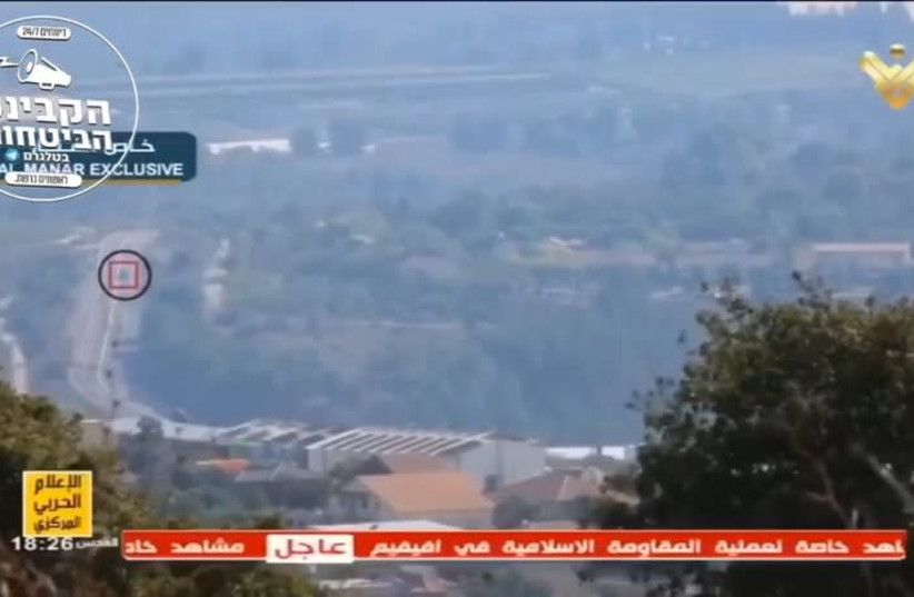 A screenshot of a Al-Manar video of a Hezbollah strike toward Israel (photo credit: screenshot)