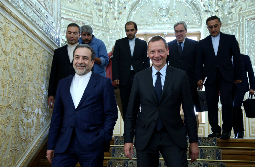  Iran's deputy foreign minister, Abbas Araqchi (L), with visiting senior French diplomat Emmanuel Bonne in Tehran, Iran, July 10, 2019.  (photo credit: NAZANIN TABATABAEE YAZDI/ TIMA VIA REUTERS)