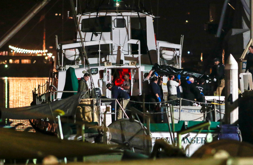 Rescue personnel return to shore with the victims of a pre-dawn fire that sank a commercial diving boat off the coast of Santa Barbara, California, U.S., September 2, 2019 (photo credit: REUTERS)