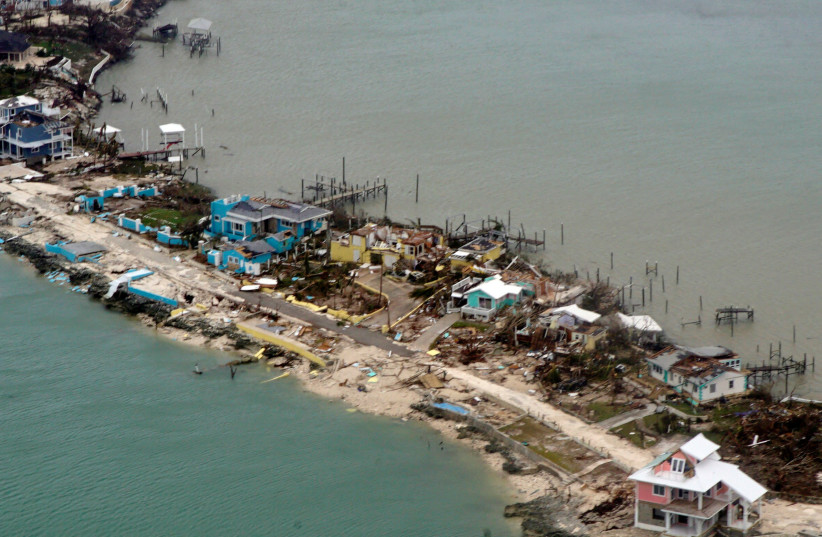 An aerial view of a row of damaged structures seen from a U.S. Coast Guard aircraft in the aftermath of Hurricane Dorian, in Bahamas September 3, 2019 (photo credit: ADAM STANTON/U.S. COAST GUARD ATLANTIC AREA VIA REUTERS)