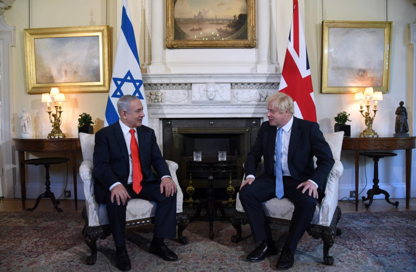 UK Prime Minister Boris Johnson [R] meets Prime Minister Benjamin Netanyahu in London [L]  (photo credit: CHAIM TZACH/GPO)