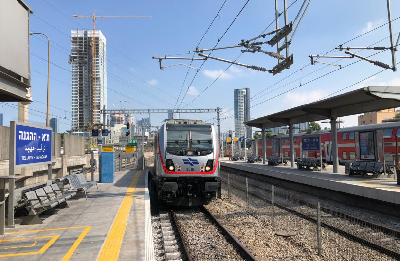 An electric train arrives at Tel Aviv's  HaHagana railway station on September 6, 2019 (photo credit: ISRAEL RAILWAYS)