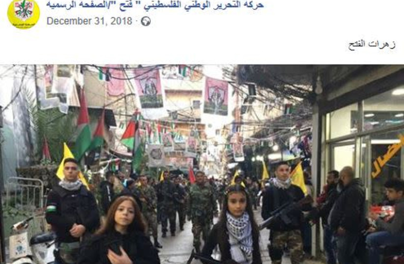 On January 1, 2019 Fatah posted a picture of young girls armed with assault rifles leading a Fatah military procession. The post text: “Fatah’s flowers.” (photo credit: screenshot)