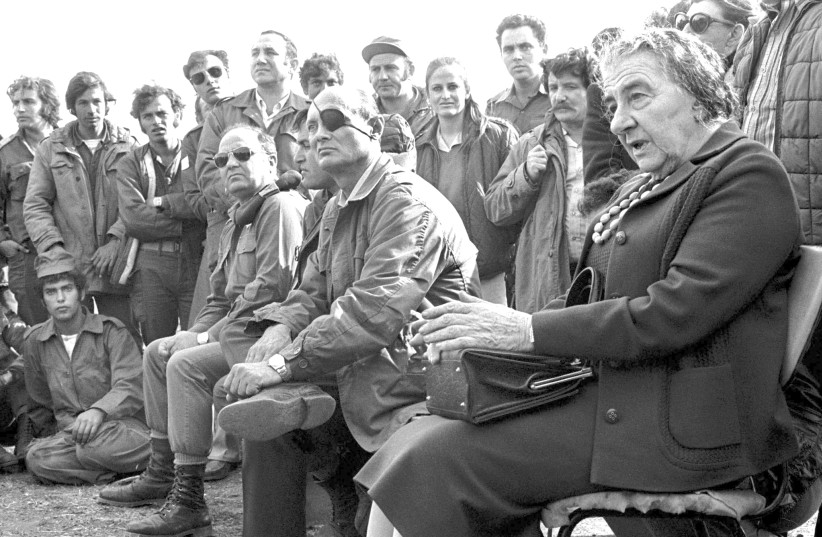Prime Minister Golda Meir [R] with Defense Minister Moshe Dayan at the Golan Heights during the 1973 Yom Kippur War (photo credit: REUTERS)
