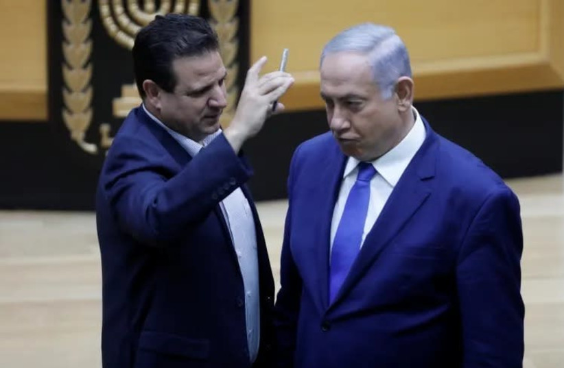 MK Ayman Odeh places camera in PM Benjamin Netanyahu's face during debate on bill legislating filming in polling stations (photo credit: ISAAC HARARI / KNESSET SPOKESPERSON'S OFFICE)