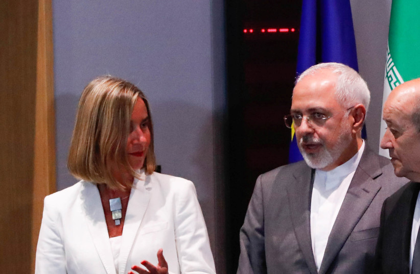 EU High Representative for Foreign Affairs Mogherini takes part in meeting with Iran's Foreign Minister Mohammad Javad Zarif in Brussels, Belgium, May 15, 2018 (photo credit: YVES HERMAN/REUTERS)
