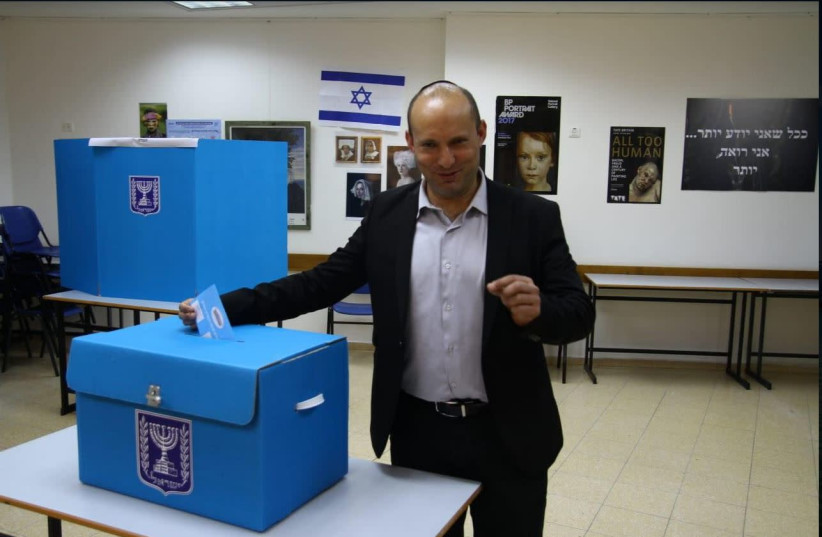 Naftali Bennett voting in Raanana (photo credit: EHUD AMITON/TPS)