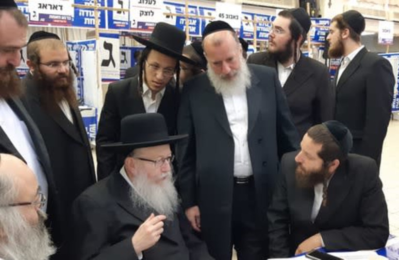 United Torah Judaism chairman Yaakov Litzman gets a briefing at the UTJ election campaign headquarters for the Jerusalem sector on Tuesday morning (photo credit: JEREMY SHARON)