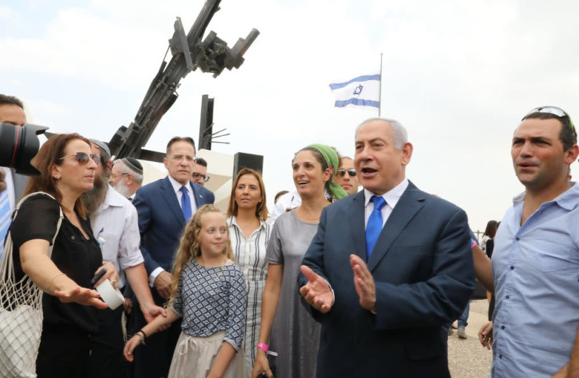Prme Minister Benjamin Netanyahu speaks next to a monument for fallen IDF soldiers (photo credit: MARC ISRAEL SELLEM/THE JERUSALEM POST)