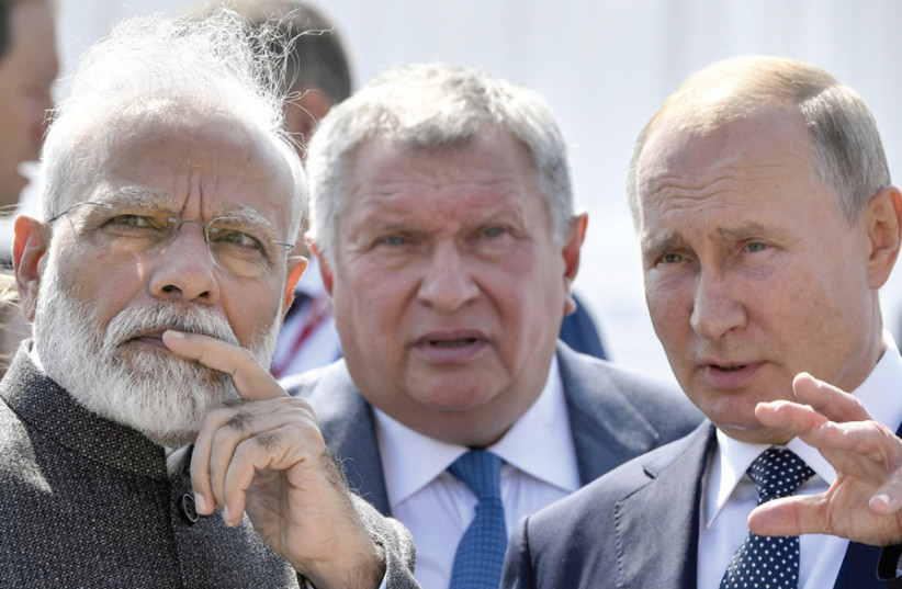 INDIAN PRIME MINISTER Narendra Modi (left) and Russian President Vladimir Putin (right) visit the Zvezda shipyard, accompanied by Rosneft CEO Igor Sechin, ahead of the Eastern Economic Forum in Vladivostok, Russia, earlier this month. (photo credit: ALEXANDER NEMENOV/REUTERS)