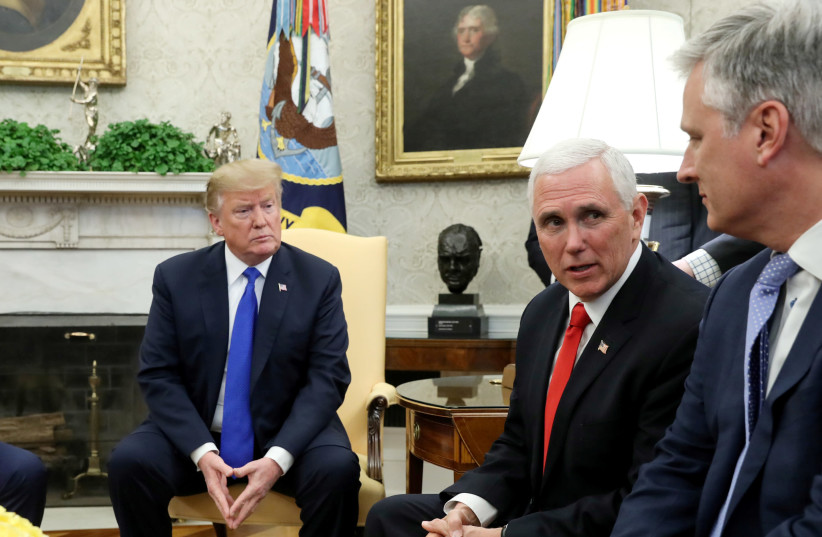 U.S. President Donald Trump and Vice President Mike Pence talk with State Department Office of the Special Presidential Envoy for Hostage Affairs Robert O'Brien (R) during a meeting in the Oval Office at the White House in Washington, U.S. March 6, 2019 (photo credit: REUTERS/JONATHAN ERNST)