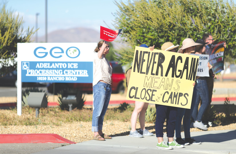 PROTESTERS DEMONSTRATE outside the ICE immigration detention center in Adelanto, California, last month (photo credit: REUTERS/LUCY NICHOLSON)