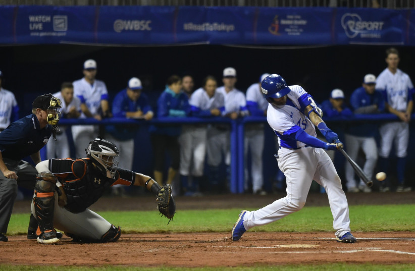 TEAM ISRAEL'S Nick Rickles connects for a two-run homer in the first inning of the blue-and-white's 8-1 victory over the Netherlands on Thursday night.  (photo credit: MARGO SUGARMAN)