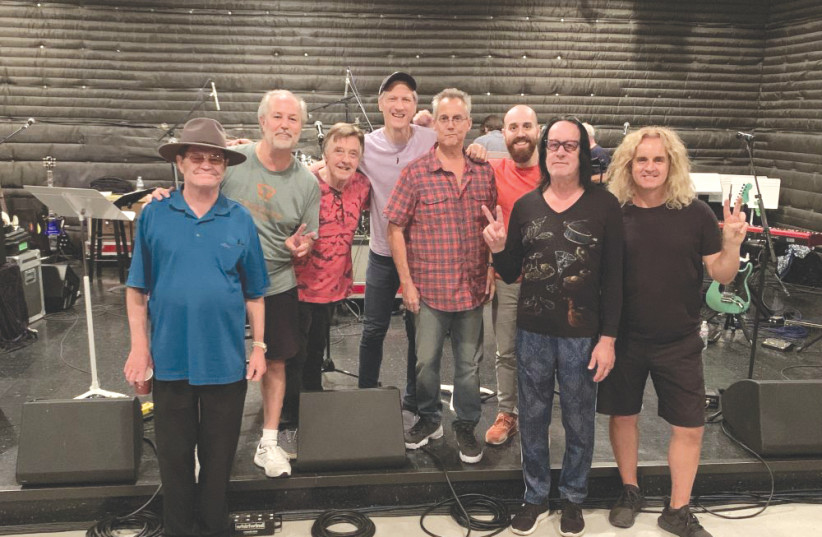 GIL ASSAYAS (third from right) with fellow Beatles tribute musicians, including Mickey Dolenz (left) and Todd Rundgren (second right) (photo credit: GLASS ONION PR)