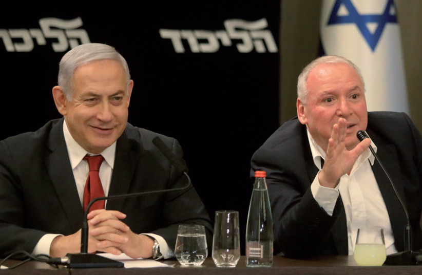 Prime Minister Benjamin Netanyahu with Communications Minister David Amsalem at a Likud meeting after the election (credit: MARC ISRAEL SELLEM)