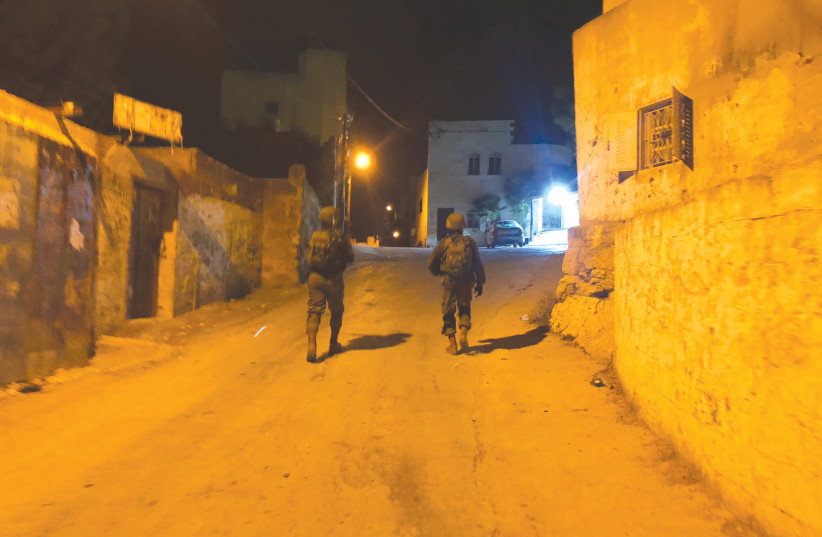 ON PATROL in the village of Kafr Nima. ‘Everyone has their time. Don’t worry, we will find them.’ (photo credit: ANNA AHRONHEIM)