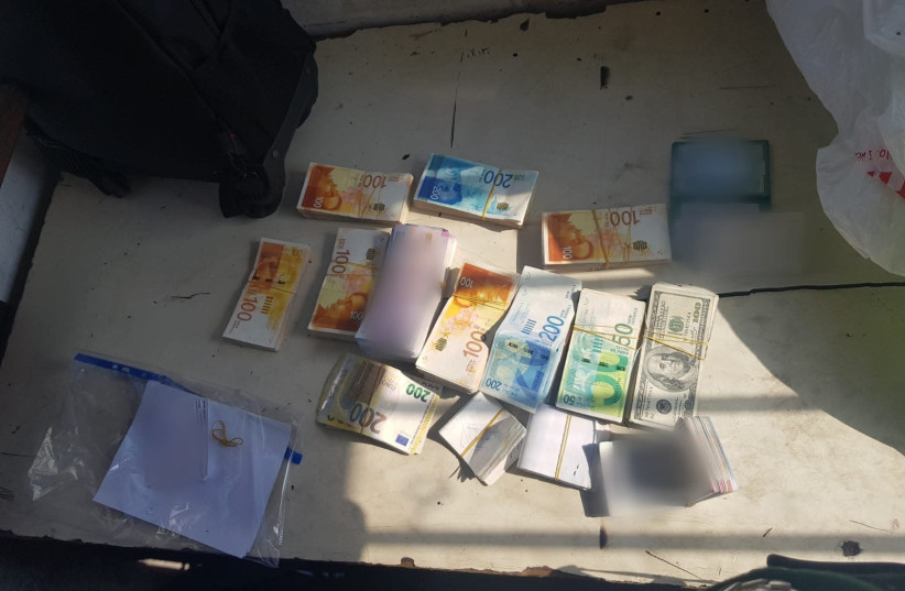 Money seized by Border Police (photo credit: REUTERS)