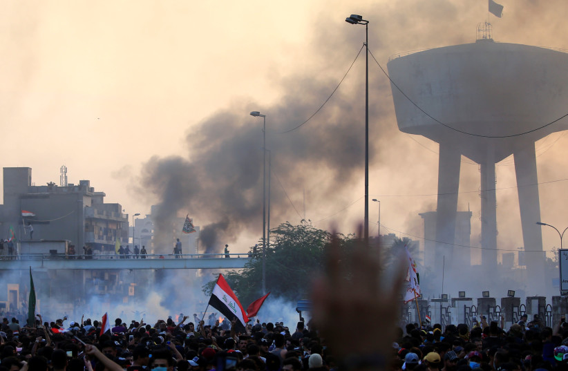 Demonstrators protest in Baghdad, Iraq, October 2019 (photo credit: THAIER AL-SUDANI/REUTERS)