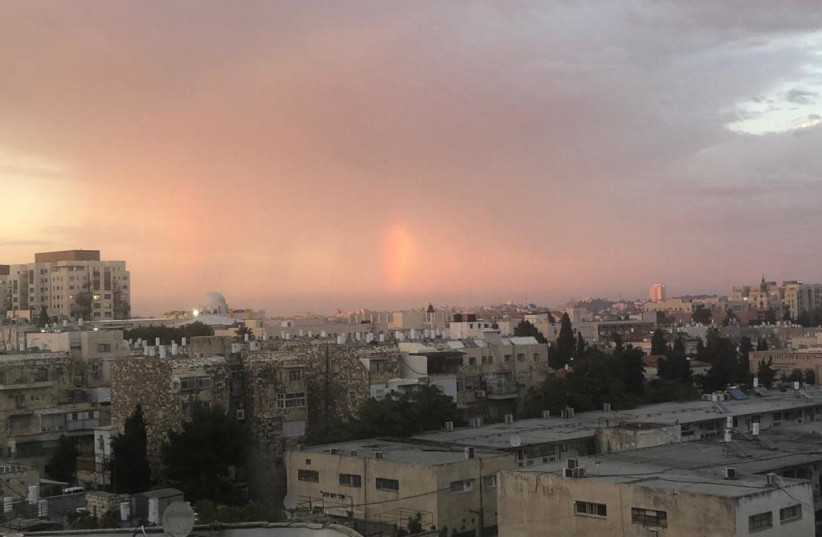 A rainbow lights up Jerusalem as the first Autumn rain hit Israeli soil. (photo credit: ZACHARY KEYSER)