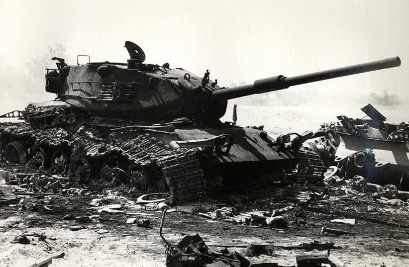 A knocked out Israeli M60 tank amongst the debris of other armor after an Israeli counterattack in the Sinai during the Yom Kippur War (credit: Wikimedia Commons)
