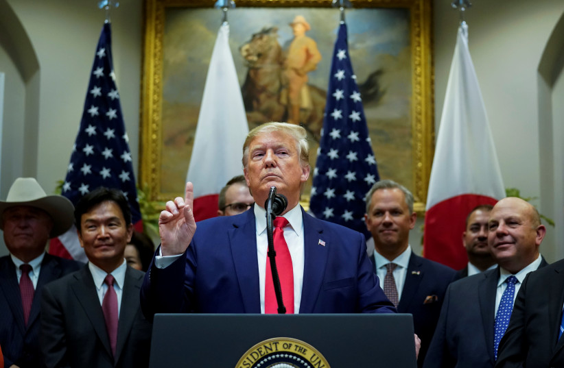 U.S. President Donald Trump speaks about Turkey and Syria during a formal signing ceremony for the U.S.-Japan Trade Agreement at the White House in Washington, October 7, 2019 (photo credit: REUTERS/KEVIN LAMARQUE)
