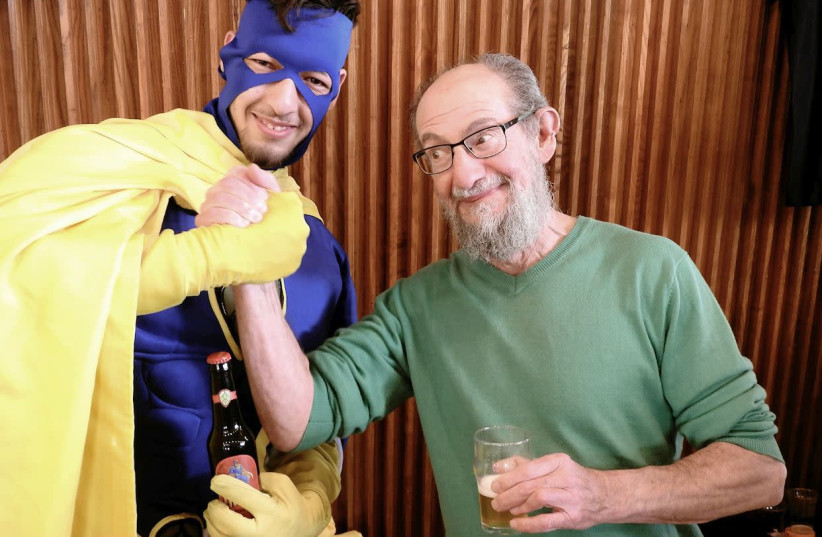 THE WRITER arm-wrestles with the SMASH superhero over the new Six-Pack IPA.  (photo credit: MIKE HORTON)