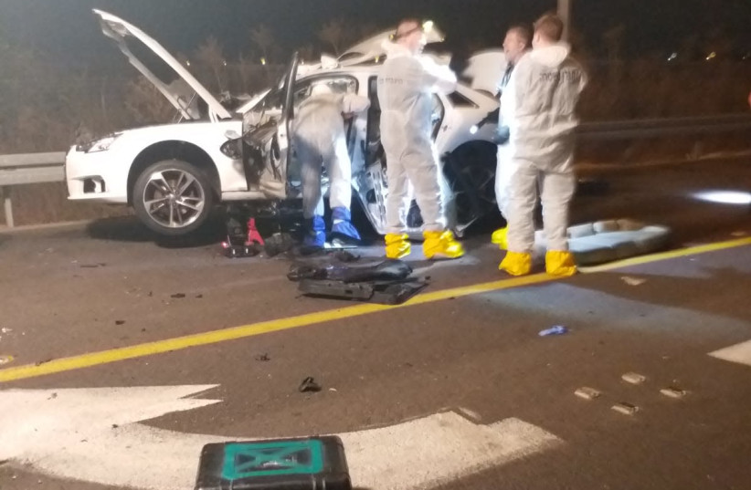 Police and rescue forces investigate an explosive device which was attached to and blew up a car close to Or Yehuda. (photo credit: POLICE SPOKESPERSON'S UNIT)