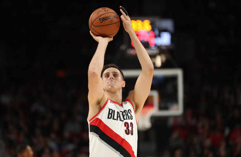 Portland Trail Blazers forward Zach Collins (33) shoots a free throw against the Phoenix Suns in the first half at Moda Center. (photo credit: JAIME VALDEZ-USA TODAY SPORTS)