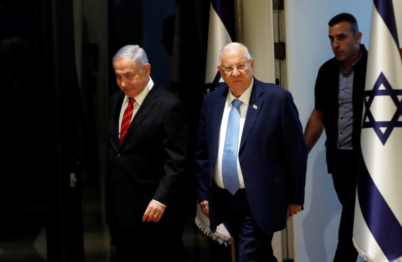 Israeli President Reuven Rivlin and Prime Minister Benjamin Netanyahu arrive to a nomination ceremony at the President's residency in Jerusalem September 25, 2019 (photo credit: RONEN ZVULUN/REUTERS)