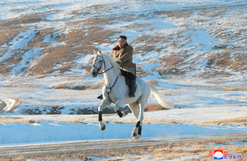 North Korean leader Kim Jong Un rides a horse during snowfall in Mount Paektu (photo credit: KCNA/VIA REUTERS)