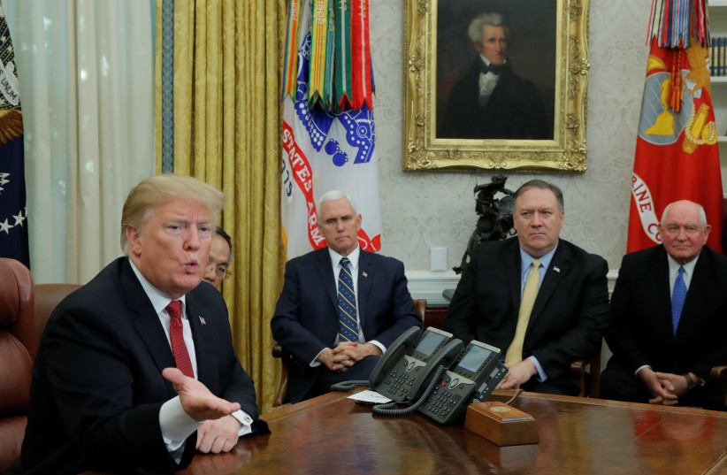 U.S. President Donald Trump speaks to China's Vice Premier Liu He as Vice President Mike Pence, Secretary of State Mike Pompeo and Agriculture Secretary Sonny Perdue look on during a meeting in the Oval Office of the White House in Washington, U.S., January 31, 2019 (credit: REUTERS/JIM YOUNG)