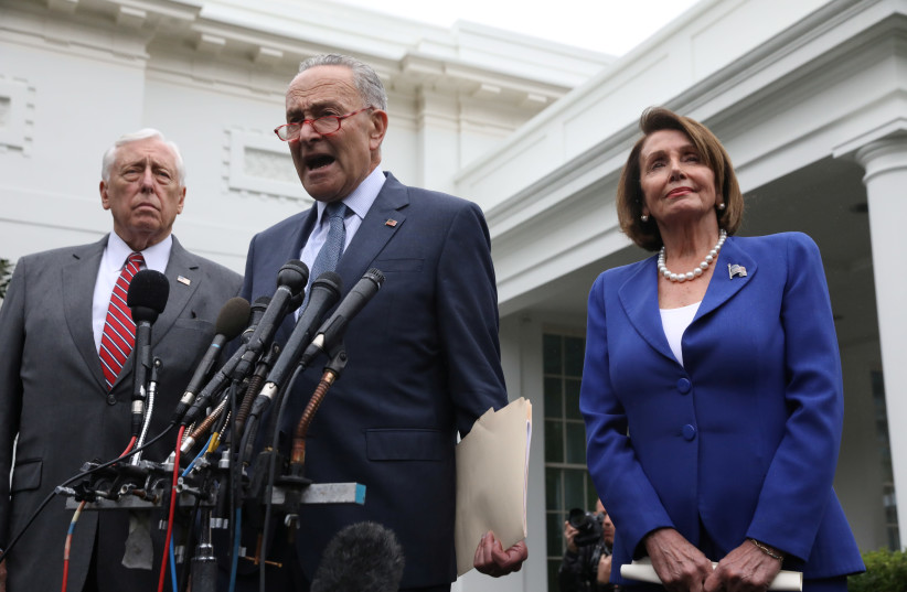U.S. Senate Minority Leader Chuck Schumer (D-NY) speaks to reporters with House Majority Leader Steny Hoyer (D-MD) and House Speaker Nancy Pelosi (D-CA) after meeting with U.S. President Donald Trump at the White House in Washington, U.S., October 16, 2019 (photo credit: LEAH MILLIS/REUTERS)
