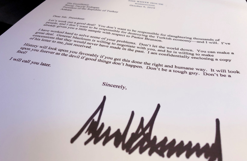 An October 9 letter from U.S. President Donald Trump to Turkey's President Tayyip Erdogan warning Erdogan about Turkish military policy and the Kurdish people in Syria is seen after being released by the White House in Washington, U.S. October 16, 2019 (photo credit: JIM BOURG / REUTERS)