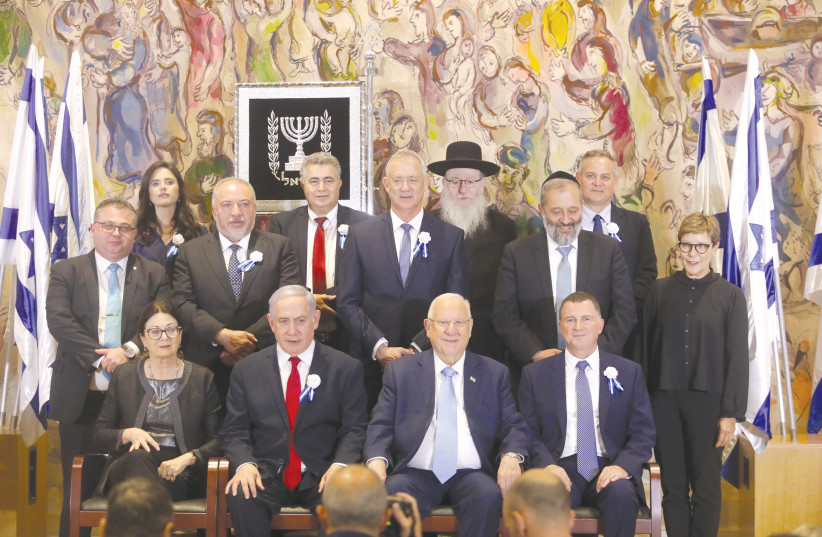 PREISDENT REUVEN RIVLIN and party leaders - including Prime Minister Benjamin Netanyahu and Blue and White leader Benny Gantz - pose for a photograph in the Chagall State Hall on October 3, when the 22nd Knesset was inaugurated. (photo credit: Courtesy)