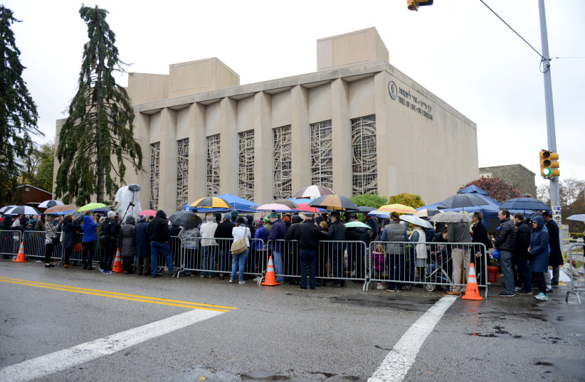 A crowd attends a vigil outside the Tree of Life synagogue Tree of Life synagogue, marking one week since a deadly shooting there, in Pittsburgh, Pennsylvania, U.S., November 3, 2018 (credit: ALAN FREED/REUTERS)
