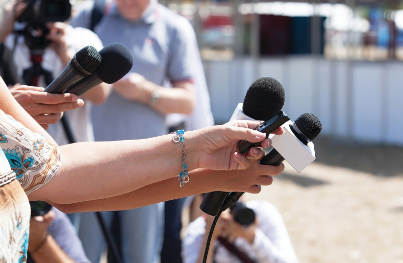 Reporters lined up at a media conference (Illustrative) (photo credit: TNS)