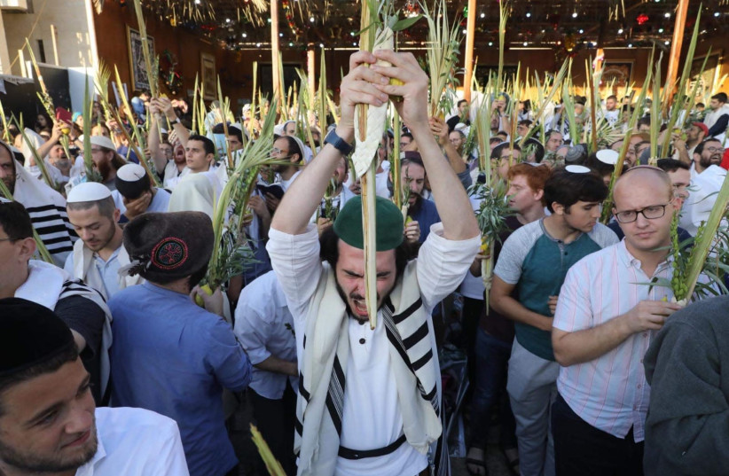 Jews celebrate Hoshanah Rabba at the Kotel, Jerusalem, October 20 2019 (credit: MARC ISRAEL SELLEM)