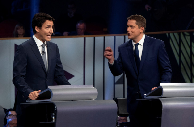 Justin Trudeau and Conservative leader Andrew Scheer take part in the Federal leaders French language debate in Gatineau, Quebec, Canada. (photo credit: ADRIAN WYLD/POOL VIA REUTERS)
