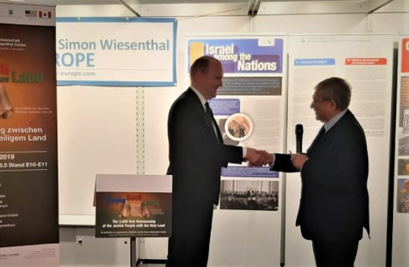 Frankfurt mayor Uwe Becker and Simon Wiesenthal Centre's Director for International Relations Shimon Samuels at the 2019 Frankfurt Book Fair. (photo credit: SIMON WIESENTHAL CENTRE)