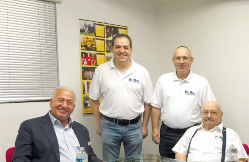 THE SHMUELI FAMILY – developers of the new engine – together with Joe Nakash, who serves as MayMaan CEO. (photo credit: DANIEL GODOY)