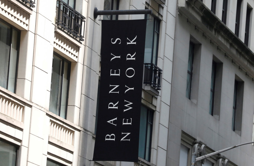 The Barneys New York sign is seen outside the luxury department store in New York (photo credit: REUTERS)