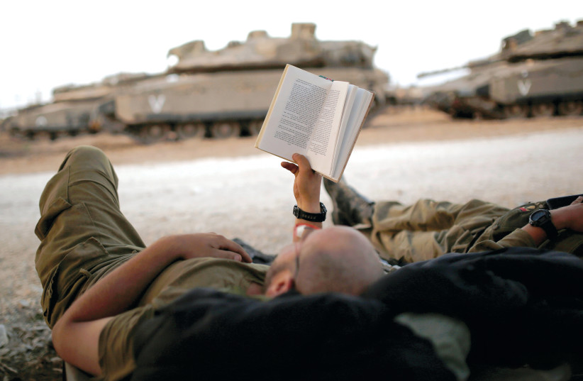 Read, soldier, read  (photo credit: REUTERS)