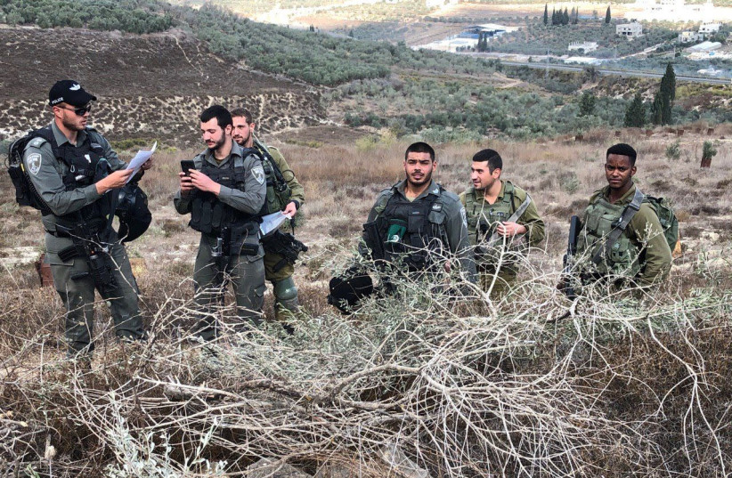 IDF and Border Police officers declaring a 'closed military zone' in Burin, October 25 2019 (photo credit: STANDING TOGETHER)