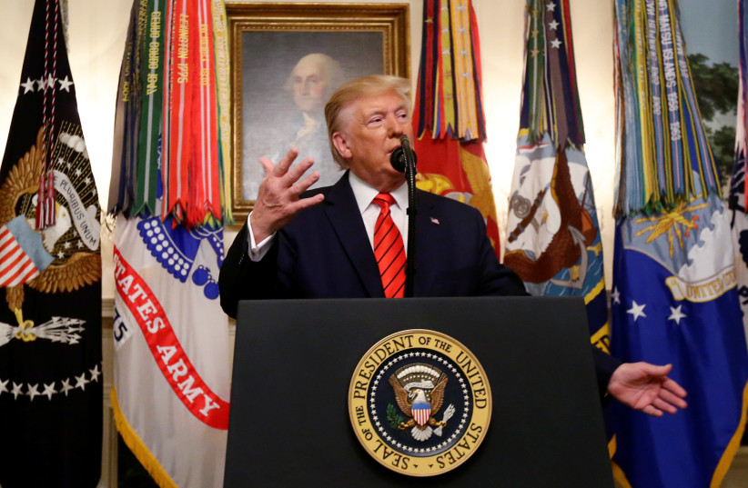 U.S. President Donald Trump makes a statement at the White House following reports that U.S. forces attacked Islamic State leader Abu Bakr al-Baghdadi in northern Syria, in Washington, U.S., October 27, 2019.  (photo credit: JIM BOURG/ REUTERS)