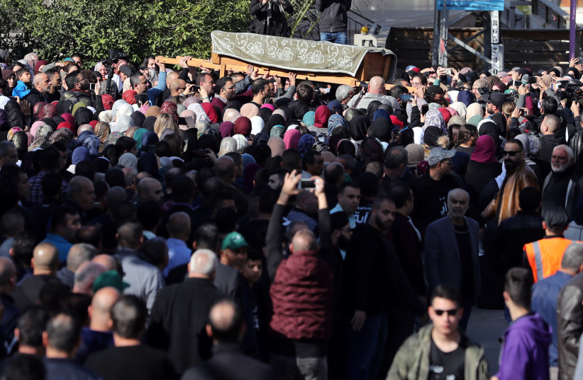 Relatives and friends carry the coffin of Aiia Maasarwe, 21, an Israeli student killed in Melbourne, during her funeral in her home town of Baqa Al-Gharbiyye, northern Israel January 23, 2019 (photo credit: REUTERS/AMMAR AWAD)