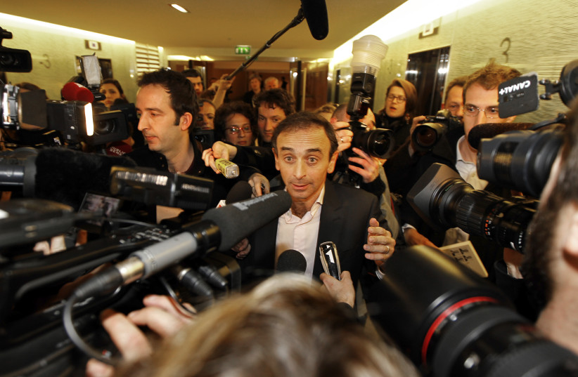 French journalist Eric Zemmour leaves after delivering a speech at UMP political party's conference at the National Assembly in Paris (photo credit: CHARLES PLATIAU / REUTERS)