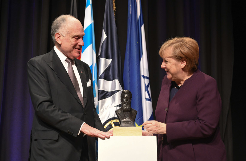WJC President Ronald S. Lauder presents German Chancellor Angela Merkel with the Theodor Herzl Award (photo credit: SHAHAR AZRAN)