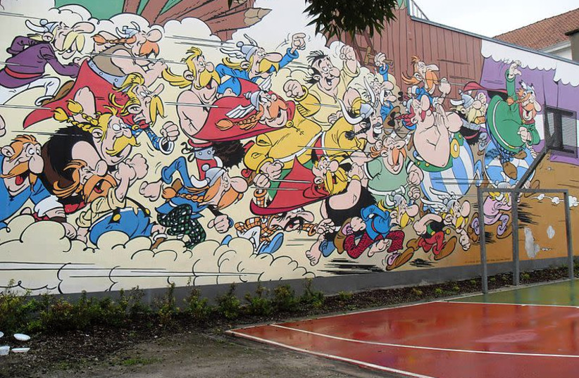 A wall featuring the cast of the 'Asterix the Gaul' series is seen in Brussles. (photo credit: Wikimedia Commons)